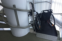 Custom-made inclined platform lift for a spiral staircase